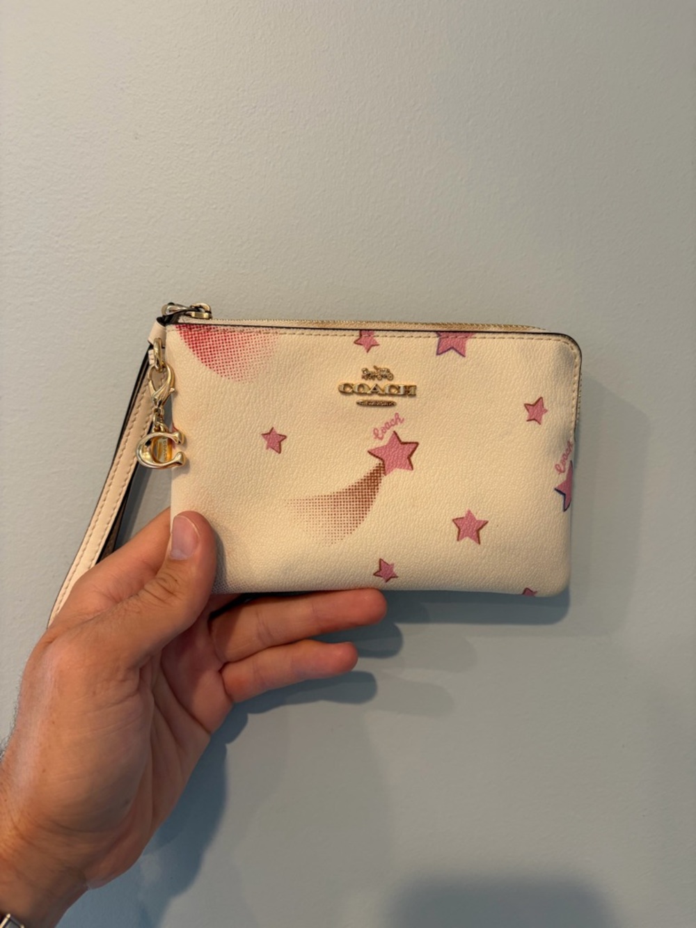 COACH Cream Wristlet with Pink Star Motif
